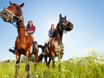 girls riding horses